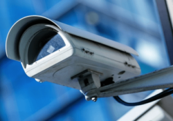 An image of a cctv camera mounted on a wall.