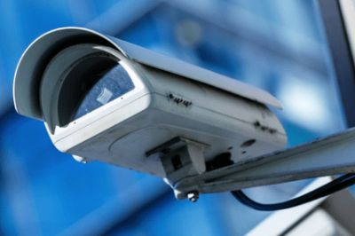 An image of a cctv camera mounted on a wall.